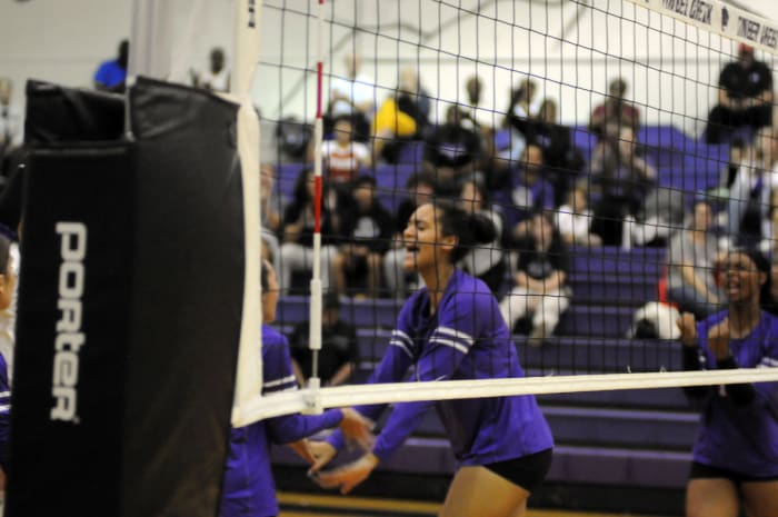 Timber Creek middle blocker Channing Warren celebrates a solo block during the second set against Lake Nona. Warren had six blocks.